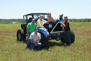 a family riding on a tractor on a farm