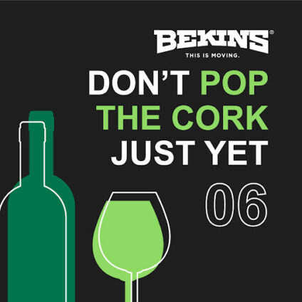 Wine bottle and glass with the words "don't pop the cork just yet".