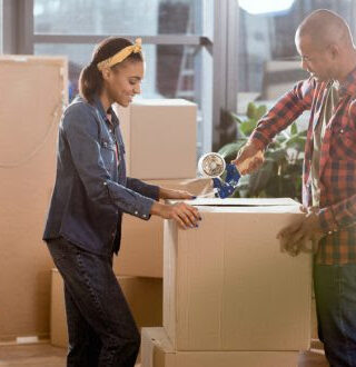 family packing moving boxes