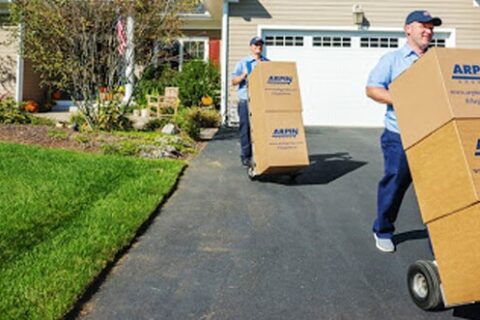 Professional movers helping someone move out of their home.