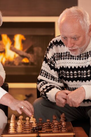 senior couple playing chess