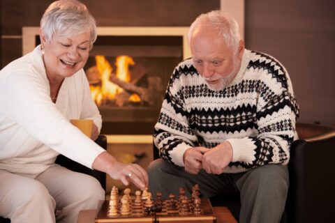 senior couple playing chess