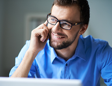 business man on the phone smiling