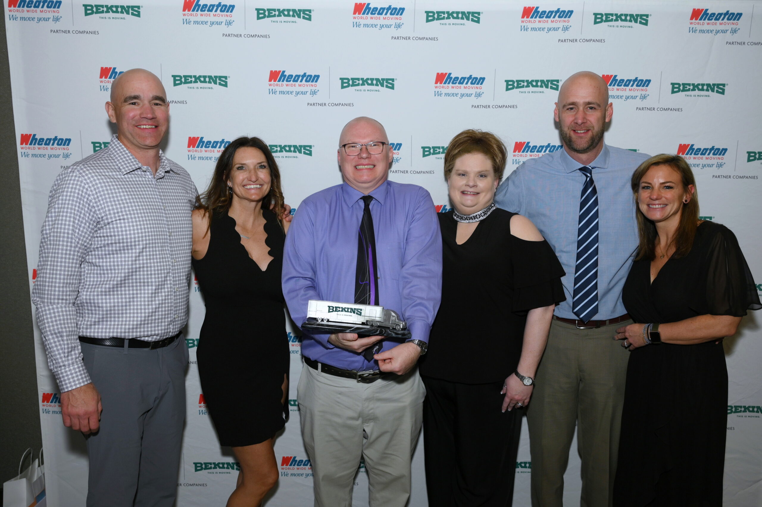 Anthony Paluch, one of the 2022 Bekins Drivers of the Year, with the owners of Boerman Moving & Storage, Inc.