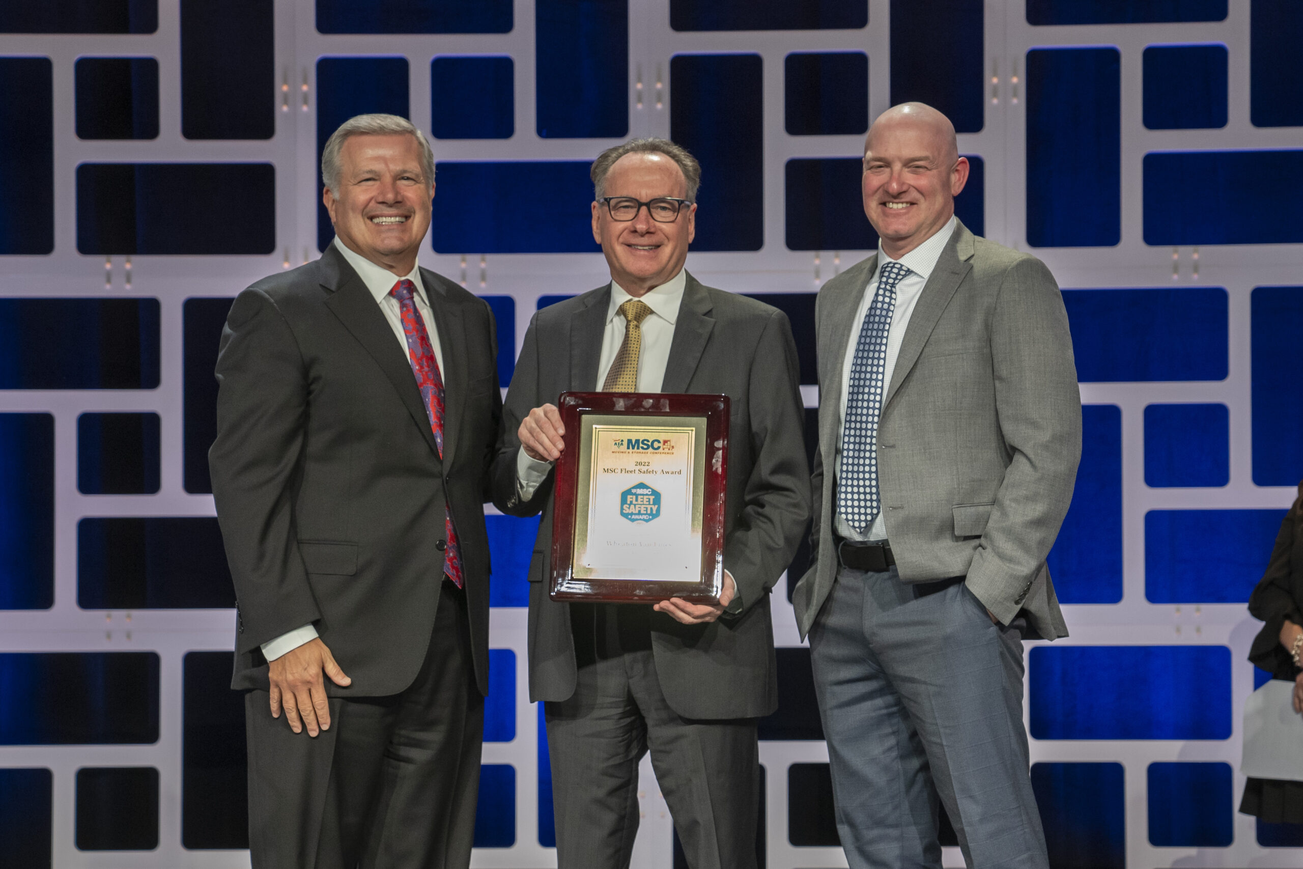 ATA MSC Chairman David Marx presents the 2022 Fleet Safety award to Wheaton CEO Mark Kirschner and president A.J. Schneider.