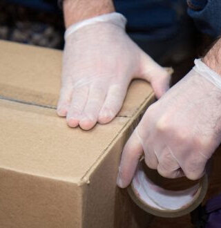 safely packing box with gloves
