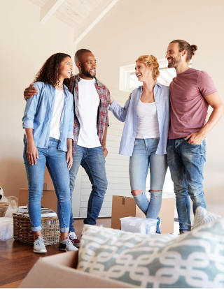 Group of friends standing in an empty home