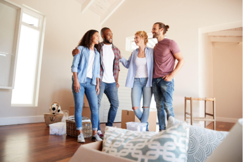 Group of friends standing in an empty home