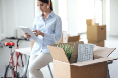 Employee looking at list while moving offices.