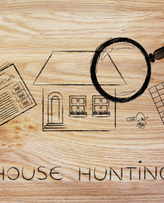 magnifying glass analyzing a house, with sector newspaper, stats and keys