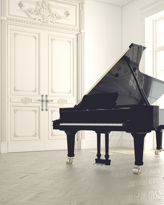 Grand piano in a fancy, clean white room