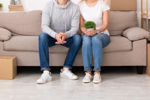couple during move surrounded by boxes