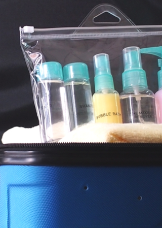 bottles of liquid packed in suitcase