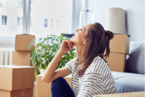 woman unpacking new office space