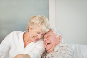 Senior couple laughing together.