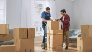 Mover and customer signing papers during a move.
