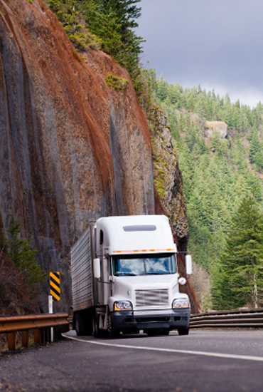 A truck driving around a curve.