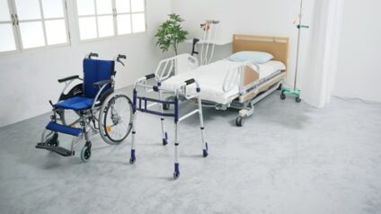 Medical equipment including a wheelchair, walker, and bed.